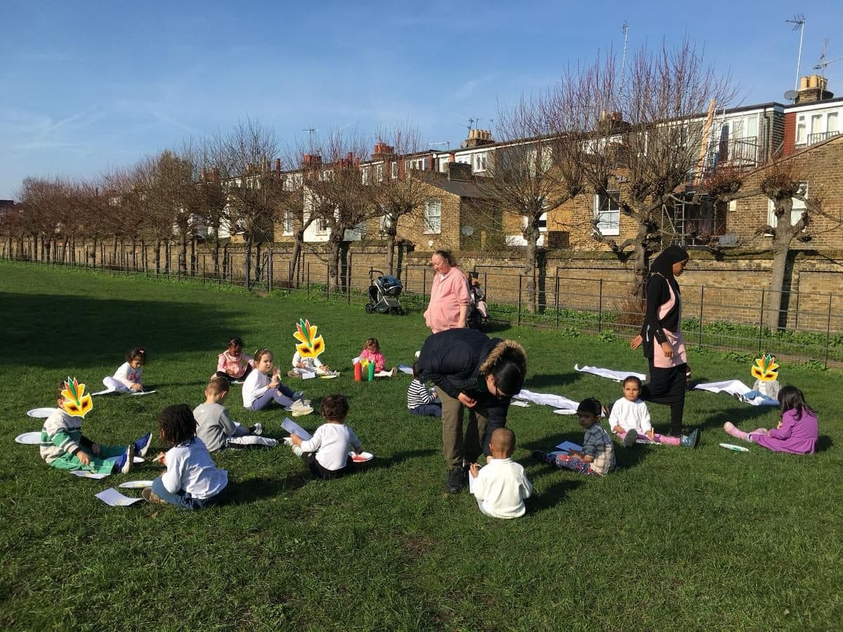 blossoming minds daycare children and practitioners outdoors eating