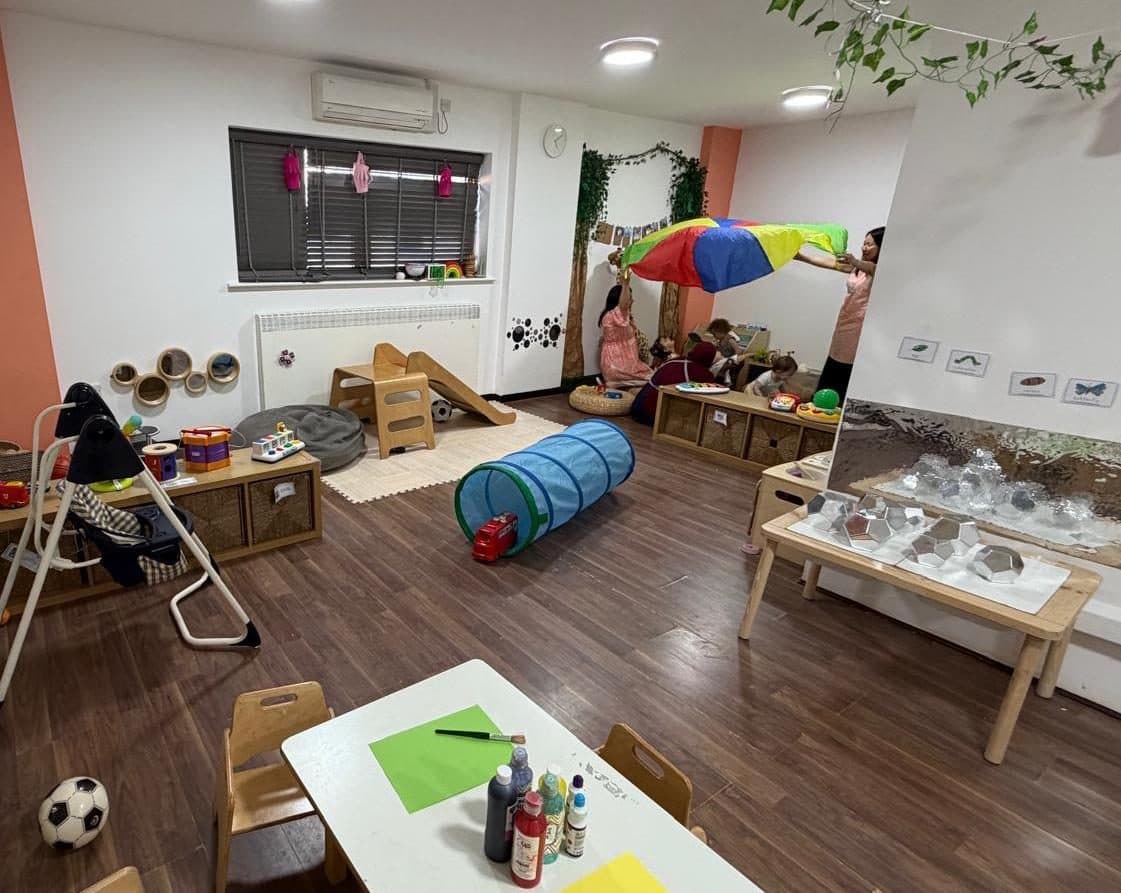 blossoming minds daycare children playing in colorful learning space