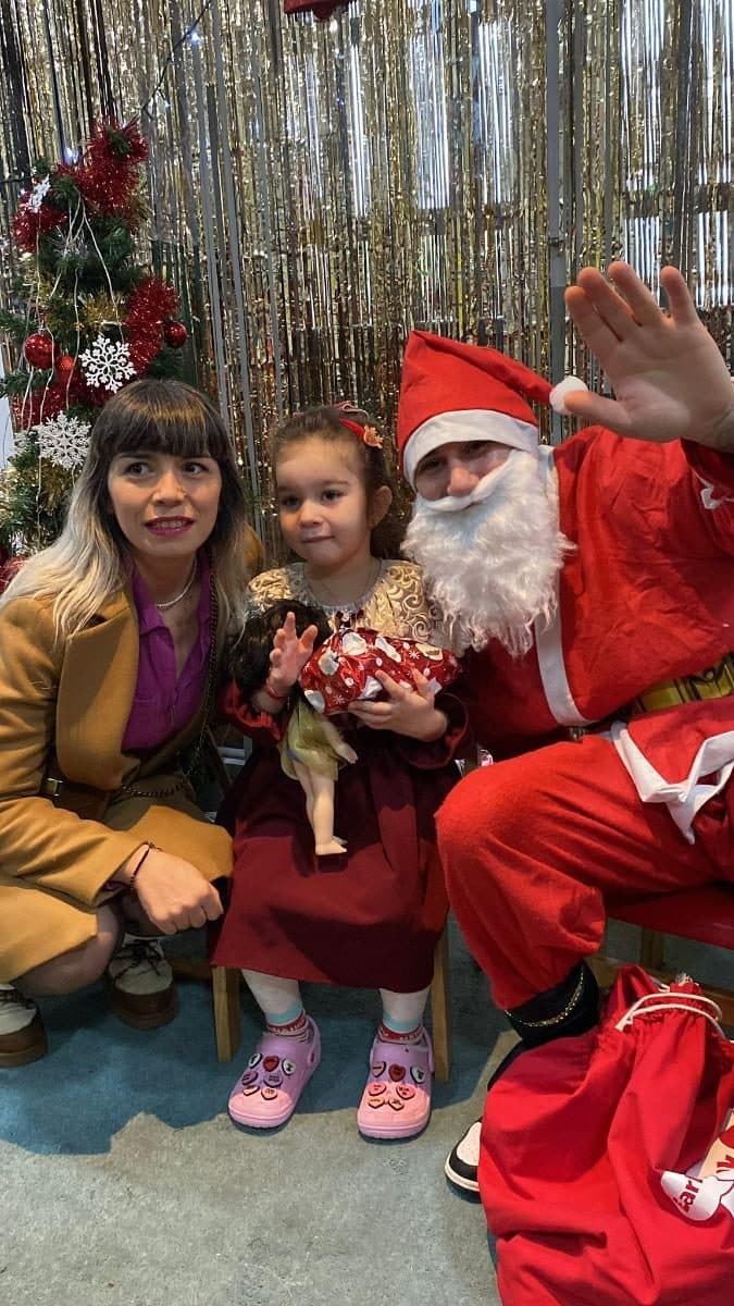 blossoming minds daycare children with santa at christmas event