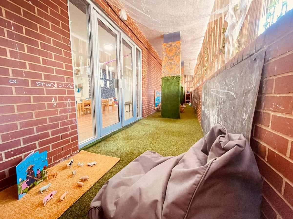blossoming minds daycare indoor courtyard with green carpet