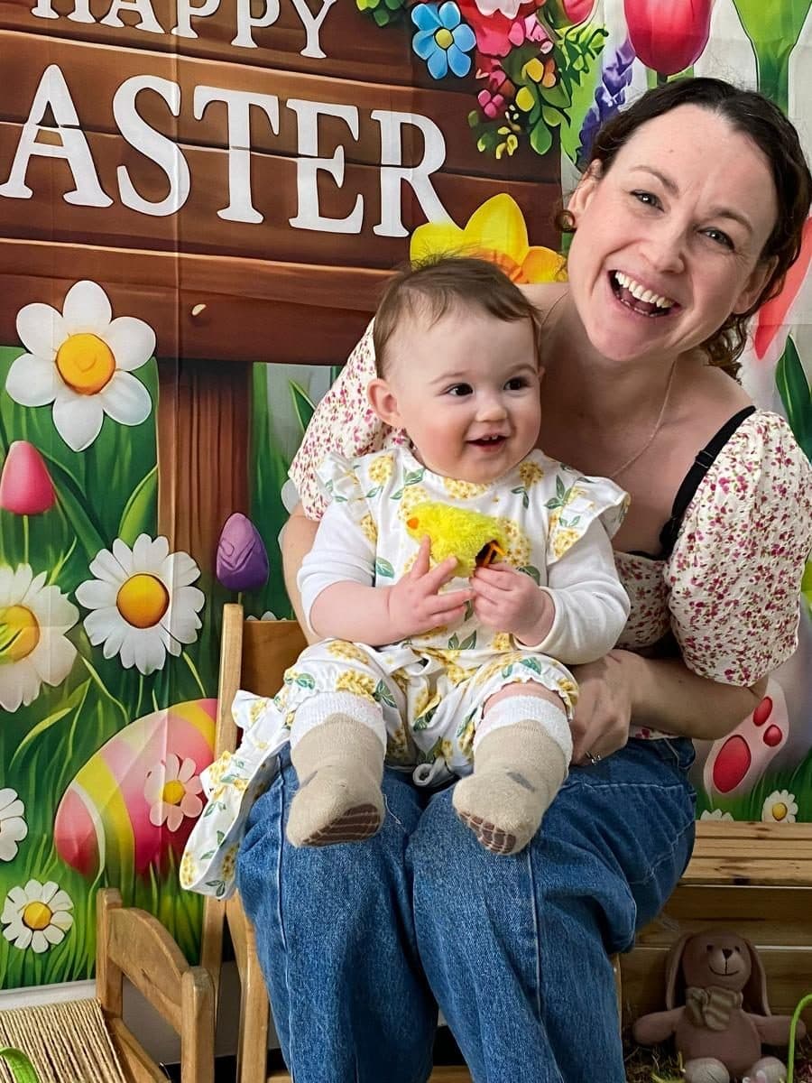 blossoming minds daycare practitioner and child celebrating easter